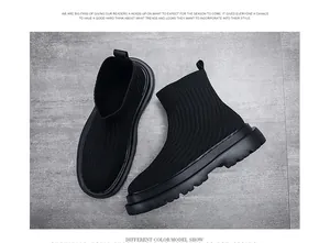 Detailed close-up of men's black breathable fly-knit sock sneakers with a chunky lugged sole