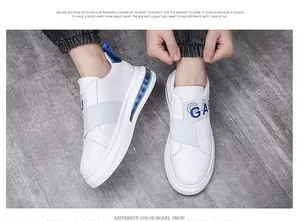 Trendy white men's casual sneakers with elastic strap and blue air cushion detail