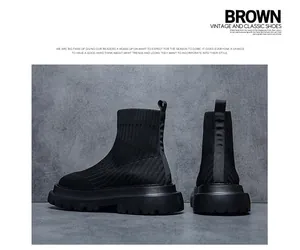 Detail view showing the back and side profiles of black knitted high-top sock shoes.