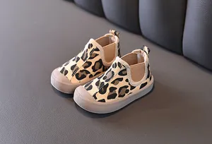 Detailed close-up showing leopard print texture of boys mid-top warm canvas shoes