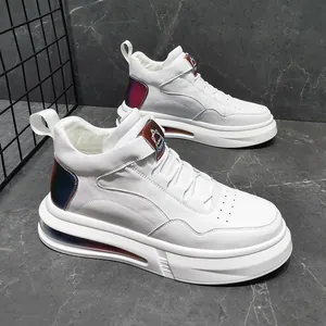 Detailed view of white high-top sneakers with chunky air cushion sole and iridescent accents