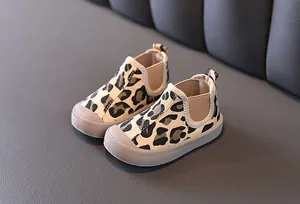 Detailed view of children's mid-top leopard print canvas shoes for autumn and winter