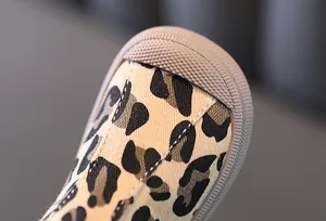 Close-up detail of leopard print canvas toddler shoes with rubber toe cap