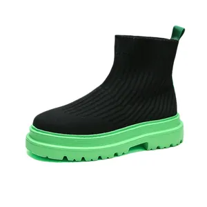 Breathable men's high-top black flyknit sock boots with thick green rubber soles
