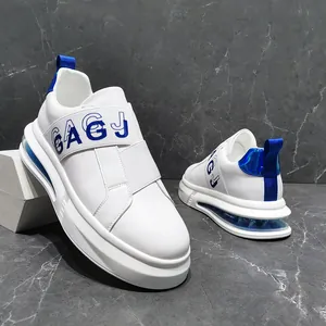 Side view of white men's fashion sneakers with blue elastic 'GAGJ' strap