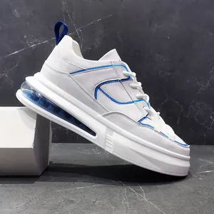 Zapatillas blancas modernas para hombre con detalles azules y cojín de aire