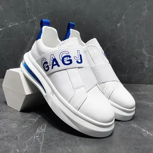 Detailed side view of stylish white men's slip-on sneakers with blue elastic GAGJ band