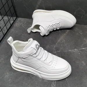 Detailed view of white high-top sneakers with visible air cushion sole