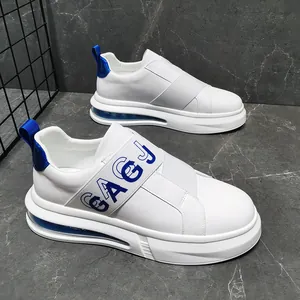 Detailed view of white men's slip-on sneakers with blue air cushion and elastic strap