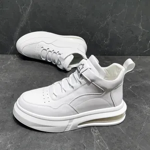 Close-up detail of white men's casual sneakers featuring a stylish air cushion sole design