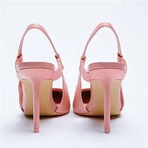 Rear view of elegant pink slingback stiletto high heels showcasing slim heel detail.