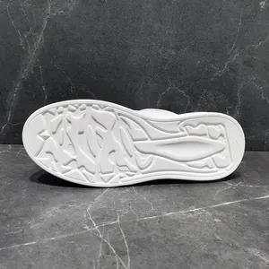 Detailed macro view of the white anti-slip rubber sole for men's trendy casual shoes.