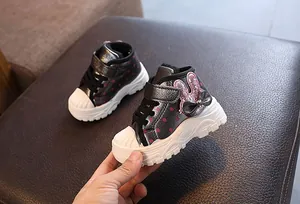 Detailed view of metallic grey winter boots for girls with pink bunny sequin embroidery