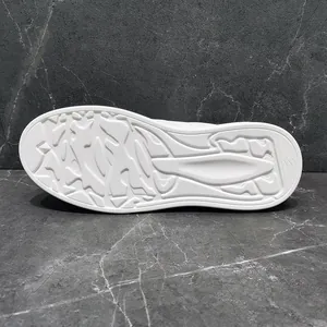 Macro view of the anti-slip white rubber outsole detail for casual slip-on men's shoes