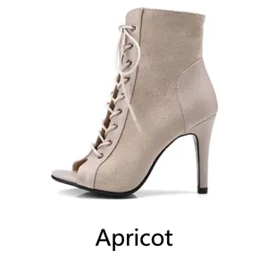 Detailed side view of elegant apricot suede lace-up peep-toe high-heeled ankle boots