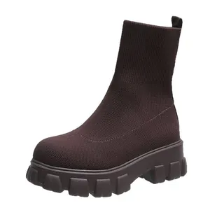 Women's brown fly-knit platform sock boots with chunky lug sole for comfort.