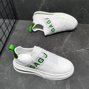 Detail of white men's slip-on sneakers with green elastic band and air cushion sole