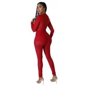 Combinaison rouge sexy transparente à manches longues pour le club et les soirées