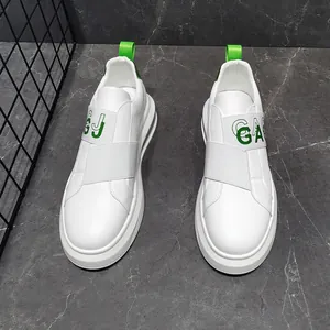 Detail of white men's slip-on sneakers with elastic strap and neon green accents