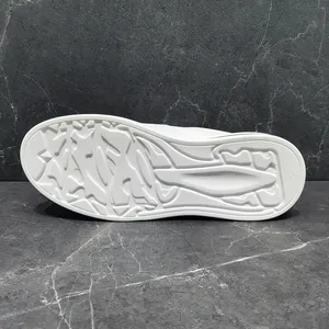 Close-up view of a durable white rubber sole with unique non-slip tread pattern