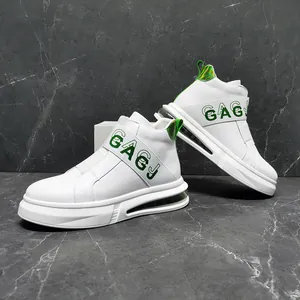 Detail shot of white high-top sneakers with green GAGJ branding and air cushion sole