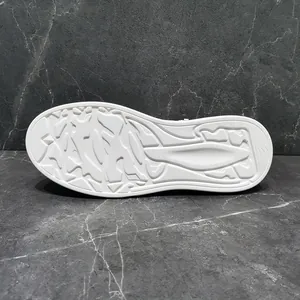 Detailed view of white anti-slip rubber outsole for men's casual lifestyle shoes.
