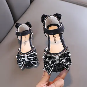 Elegant black girls' princess shoes with sparkling bowknot and pearl details for parties