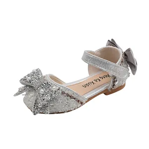 Silver sparkly girls' princess shoes with rhinestone bow detail for dancing and parties
