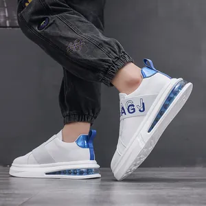Stylish white men's slip-on fashion sneakers with blue accents and blue air cushion sole