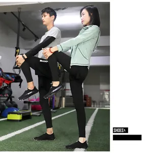 Couple wearing black breathable water shoes for gym yoga stretching workout session