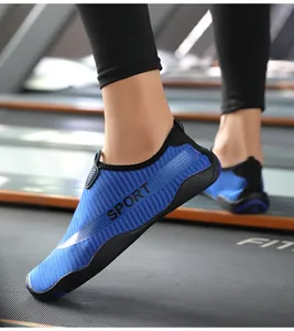 Detailed side view of blue breathable mesh yoga shoes with non-slip sole on a treadmill