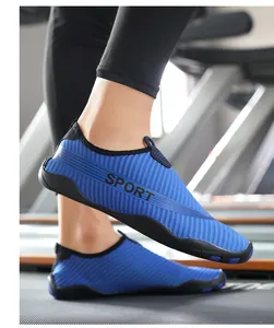 Close-up detail of blue striped lightweight wading shoes for yoga and water sports.
