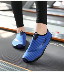 Close-up of breathable blue aqua shoes worn on a treadmill for gym fitness and yoga