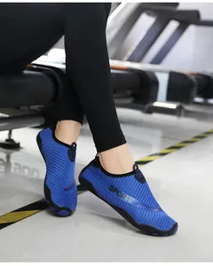 Detail view of breathable blue striped water shoes with flexible non-slip rubber sole