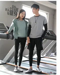 Professional breathable couple's gym shoes worn by models on treadmills in a fitness gym