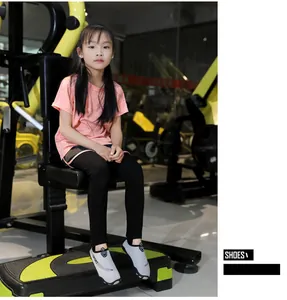 Child wearing breathable water shoes in a gym setting for fitness and comfort