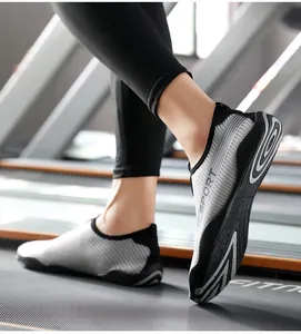 Close-up of grey striped fitness water shoes on a treadmill showing the flexible sole.