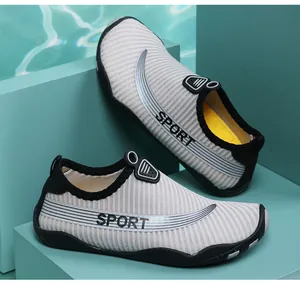 Close-up of breathable grey water shoes with "SPORT" text for beach and pool swimming