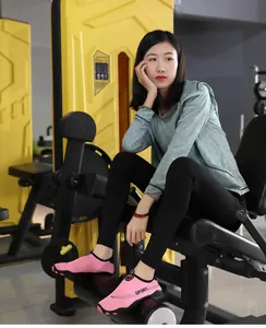 Asian model wearing pink breathable non-slip fitness wading shoes in gym setting