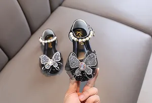 Zapatos de princesa negros para niña con correas de perlas y grandes lazos de mariposa