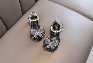 Elegantes zapatos de princesa negros para niñas con mariposa de strass y perlas