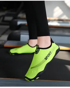 Detailed view of vibrant neon green barefoot water shoes for yoga fitness and sports