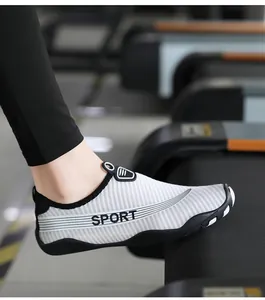 Close-up of a breathable grey striped water shoe for yoga and fitness sessions