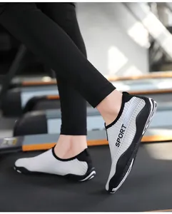 Detail view of breathable striped fitness shoes on a treadmill for yoga or water sports