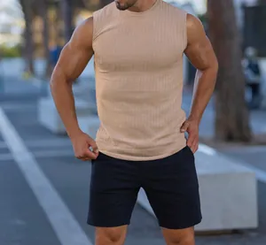 Detailed view of men's slim fit ribbed knit muscle tank top in tan summer fabric