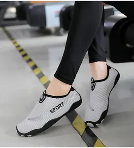 Close-up of breathable gray striped water shoes for indoor yoga and beach activities