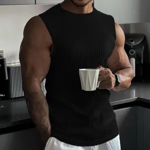 Detailed view of a black ribbed knitted fitness vest highlighting the muscle-fit athletic style