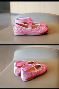 Detailed side and rear view of sparkly pink girls' princess shoes with elastic cross straps.