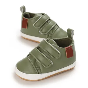 Close-up of olive green PU leather baby shoes with triple hook-and-loop straps