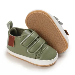 Detailed view of olive green baby walking shoes with non-slip textured rubber sole